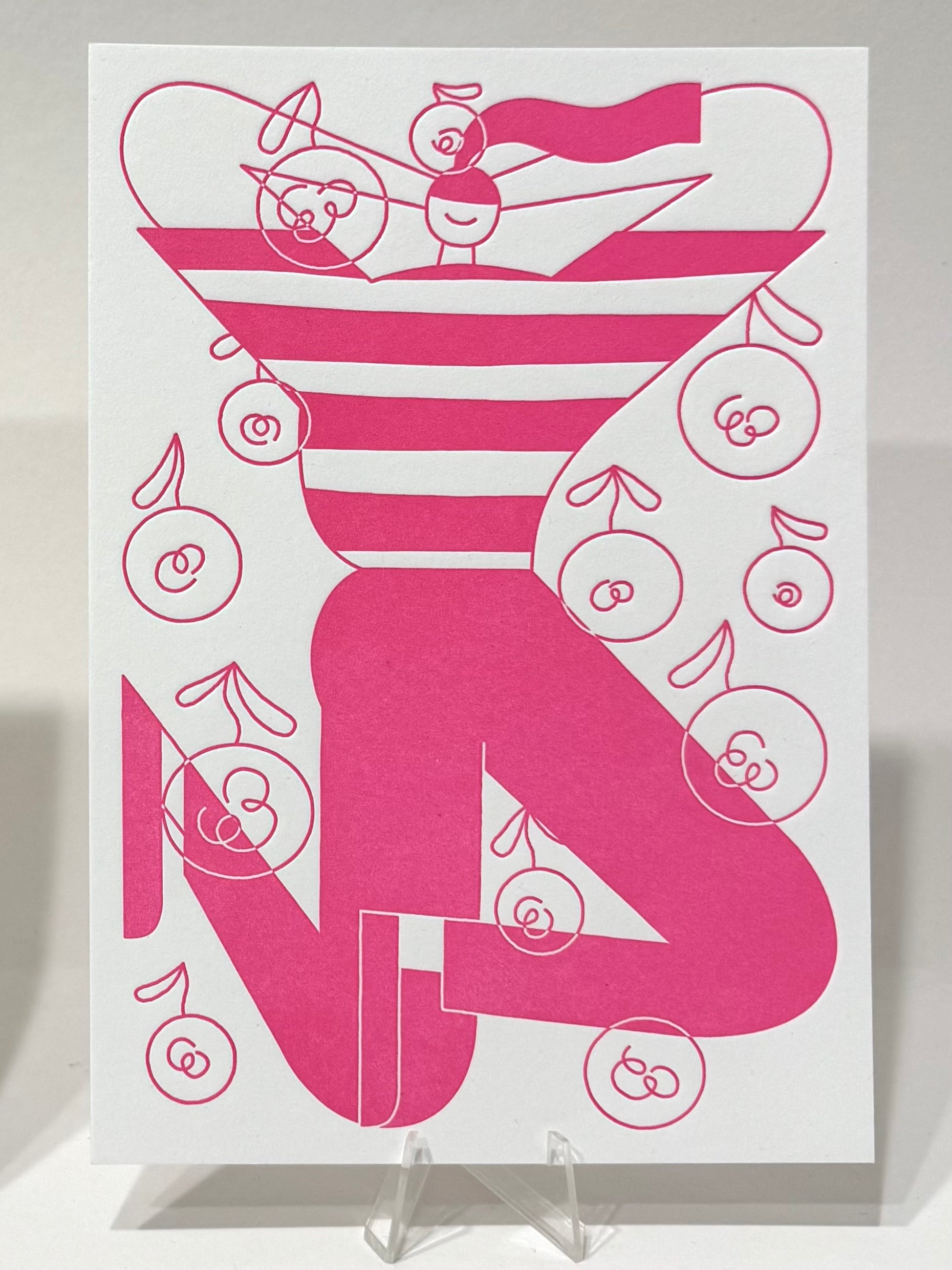 Letterpress Druck von Anne Albert, Titel „Field of flowers“. Modern, illustrative Darstellung einer Person mit langem Zopf, gestreiftem T-Shirt und dunkler Hose. Um die Person Blumen in reduzierter Form angeordnet. Farbvariante in Magenta/Pink, Druck auf Papier , erhältlich bei What The Artist made